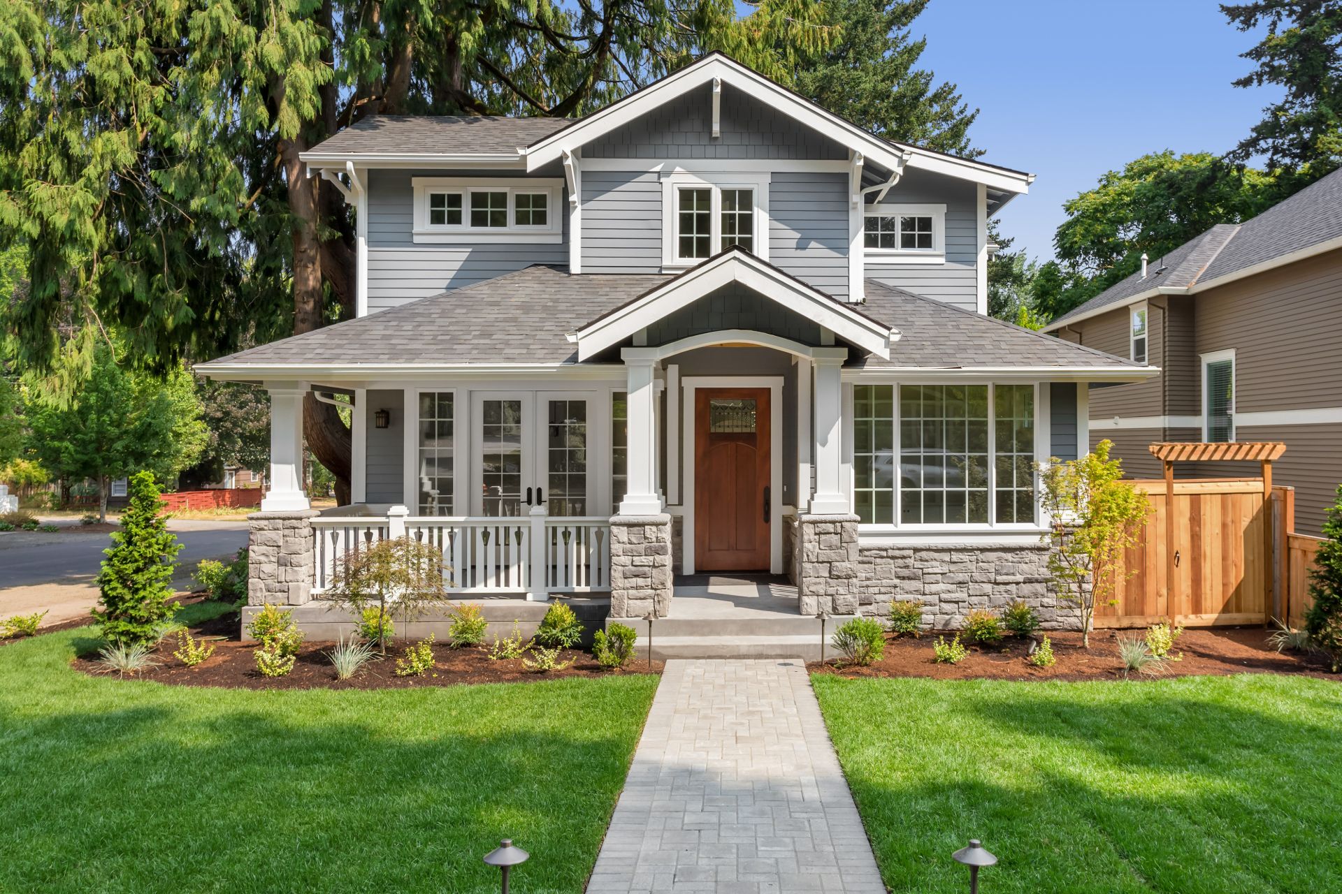 Well-maintained front yard resulting from consistent lawn care in Indiana